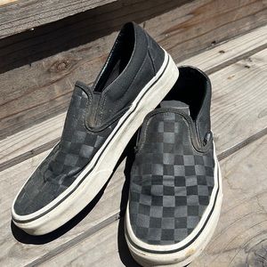 Worn but still good black checkered vans
